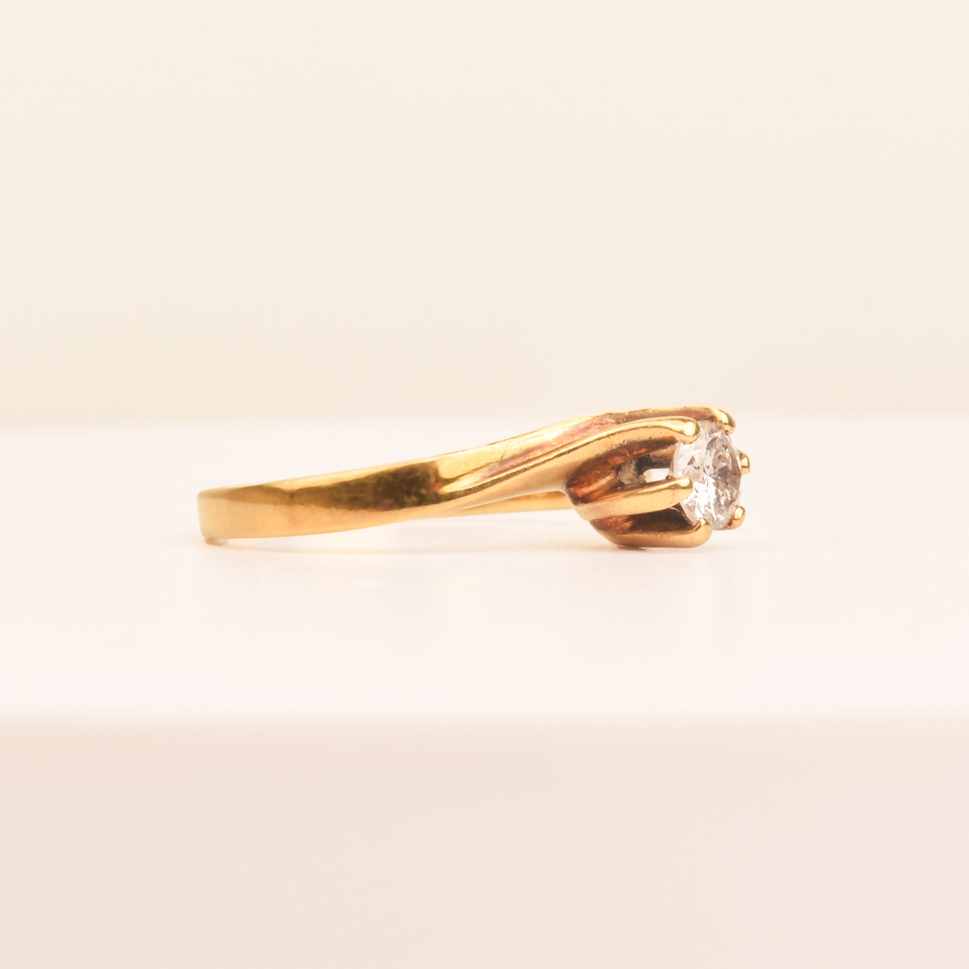 18K yellow gold diamond solitaire engagement ring with 6-prong spiral setting, size 7.5 US, displayed against a neutral background.