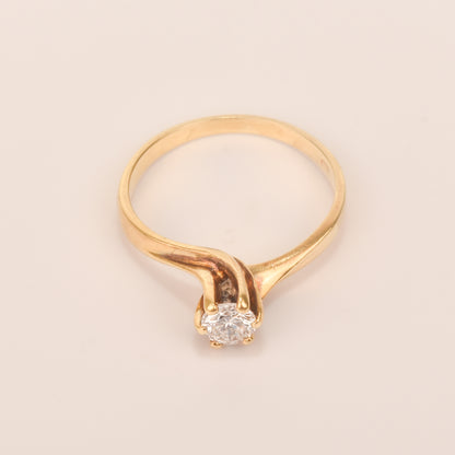 18K yellow gold diamond solitaire engagement ring with a 6-prong spiral setting, size 7.5 US, on a plain background.