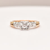 14K two-tone gold diamond engagement ring with a .25 carat brilliant center stone and side diamonds, size 9 US, displayed on a white background.