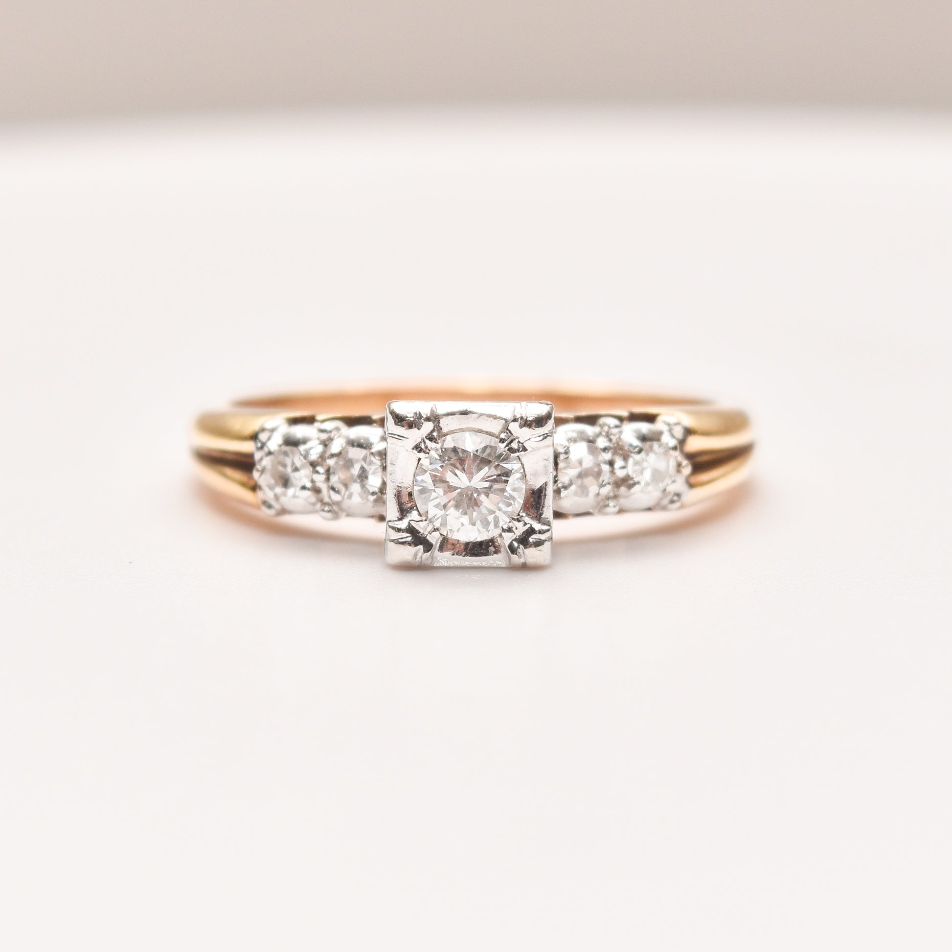 14K two-tone gold diamond engagement ring with a .25 carat brilliant center stone and side diamonds, size 9 US, displayed on a white background.