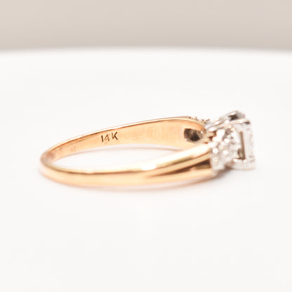 14K two-tone gold diamond engagement ring with .25 carat brilliant cut center stone, size 9 US, on white background.