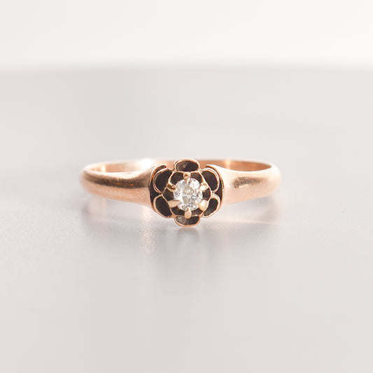 Antique 10K gold diamond engagement ring with .12 CT old mine cut, showcased as estate jewelry, size 7.75 US, on a seamless white background.