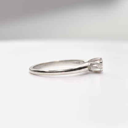 Minimalist 14K white gold engagement ring with a .25 carat brilliant solitaire diamond, size 6.25 US, displayed on a white background.