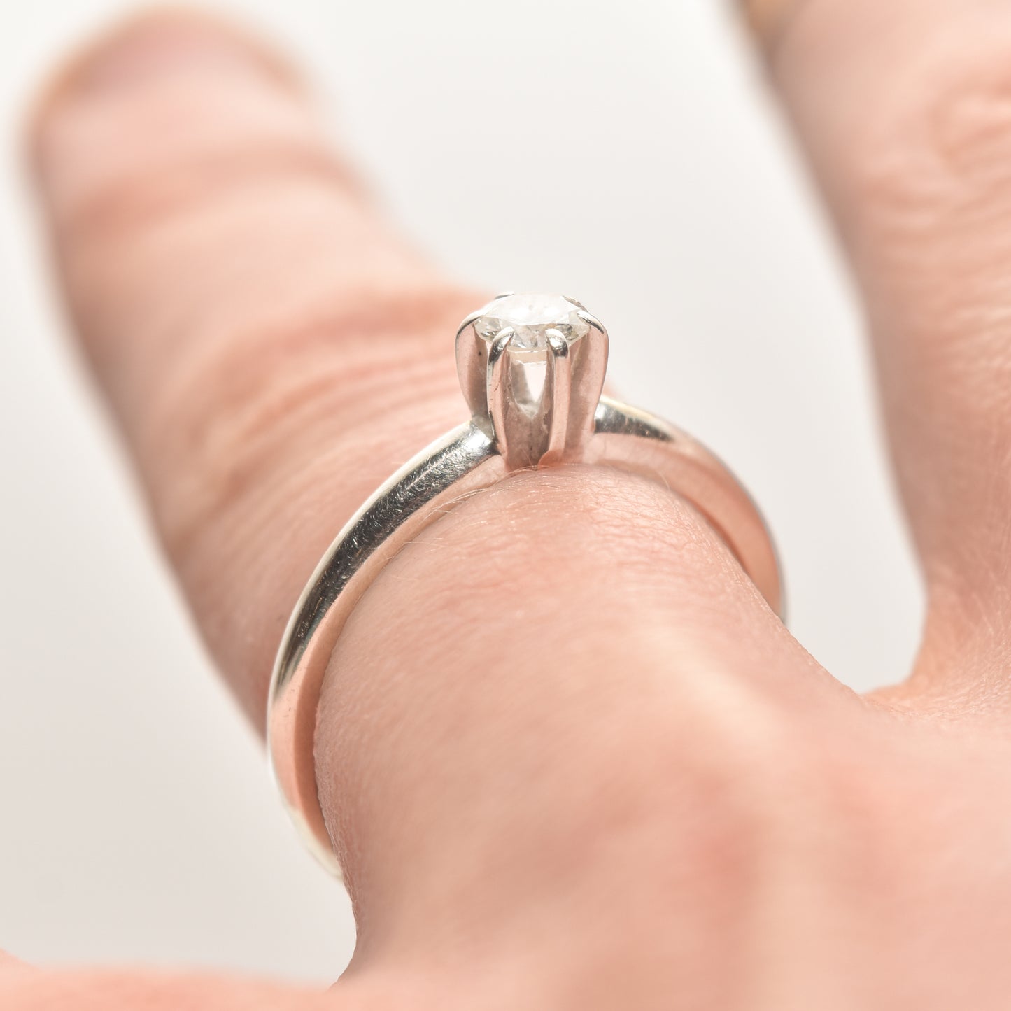 Elegant 14K white gold diamond solitaire engagement ring, 0.25 carat brilliant cut on a size 6.25 finger