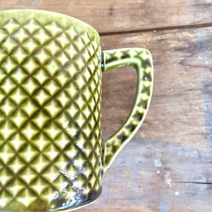 Vintage Holt Howard green ceramic mugs with textured diamond pattern on wooden surface, midcentury modern drink ware suitable for housewarming gift or gift for her.