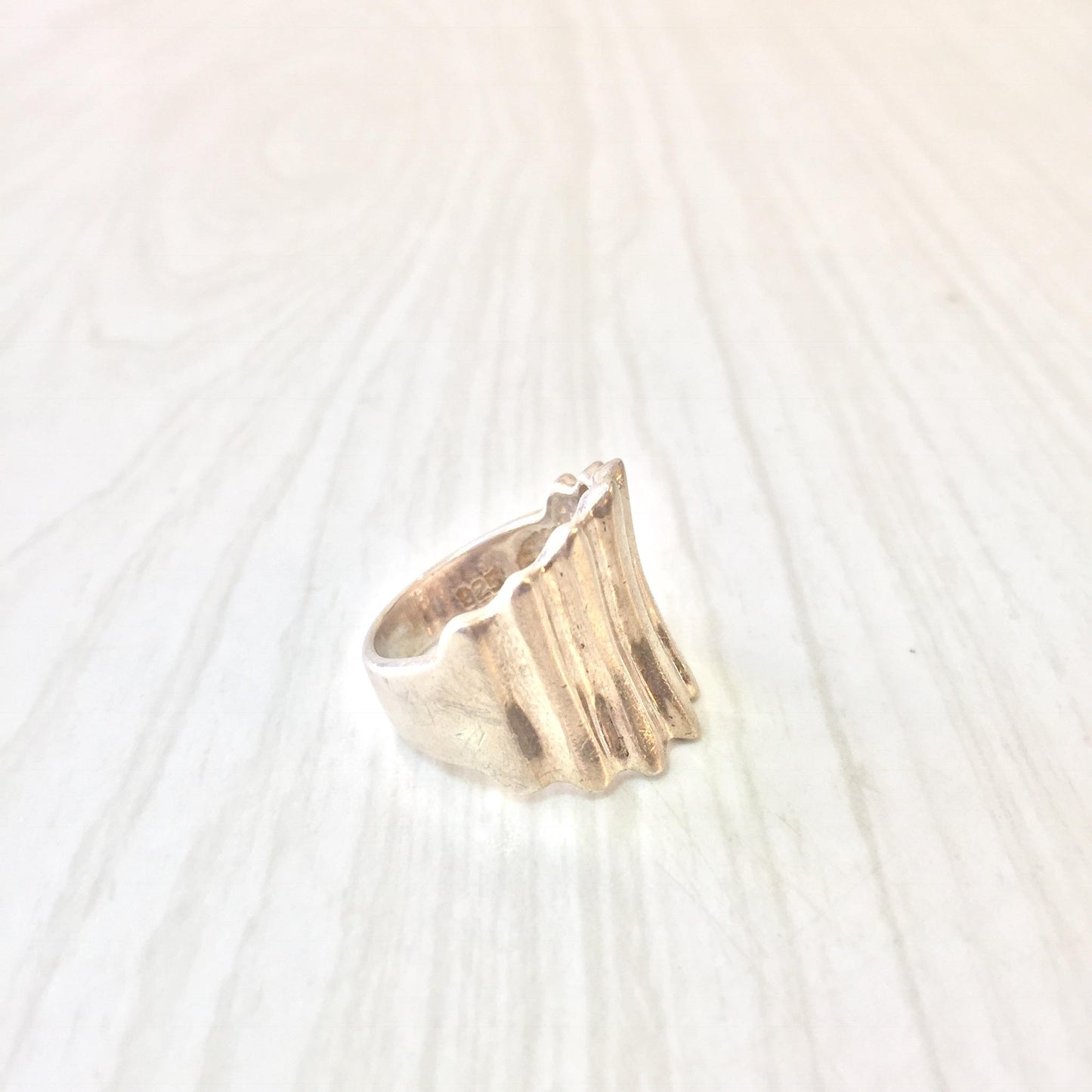 Sterling silver statement ring with textured concave design, suitable as a unisex vintage jewelry gift.