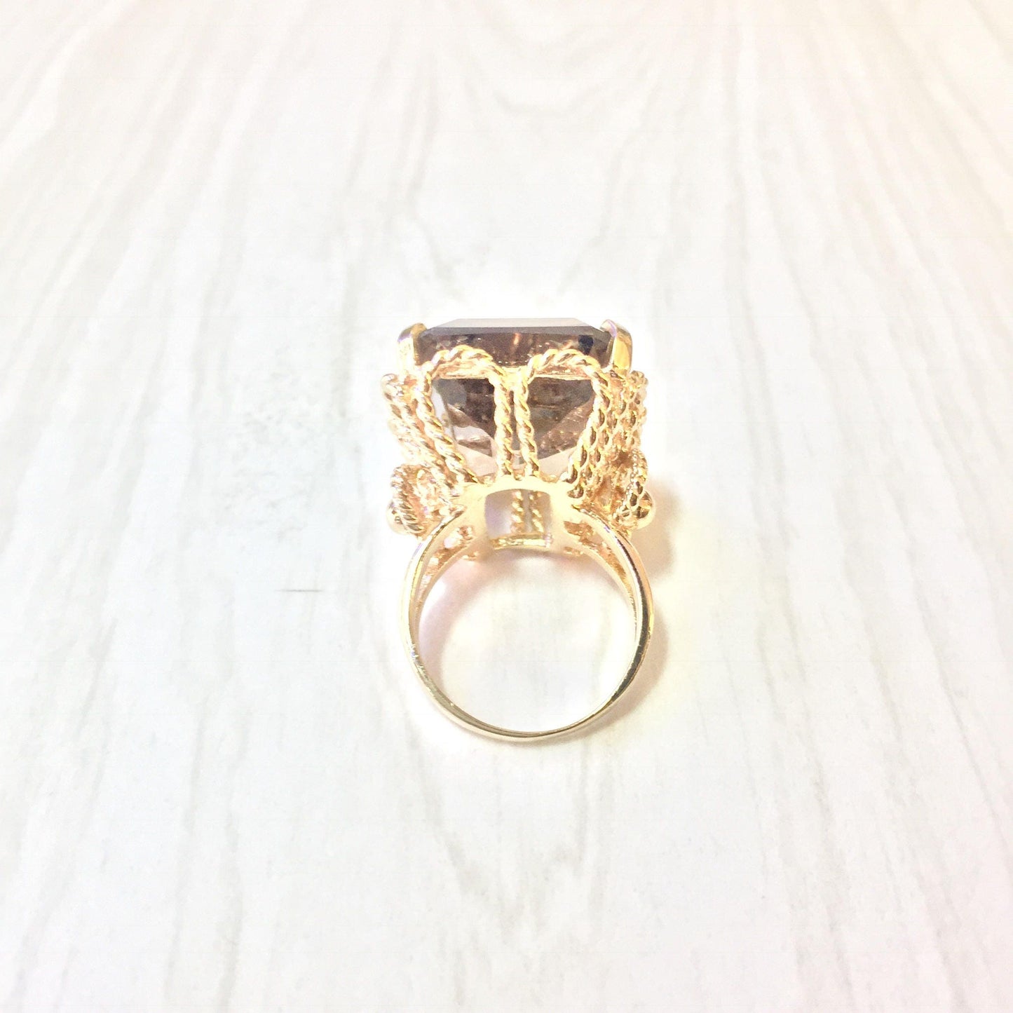 14K yellow gold smoky quartz cocktail ring with ornate setting and emerald cut center stone, statement jewelry piece