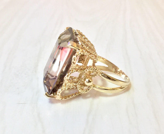 14K yellow gold statement cocktail ring featuring an emerald cut smoky quartz gemstone, ornate gold detailing on the band, size 7 US, perfect for a special occasion or gift.