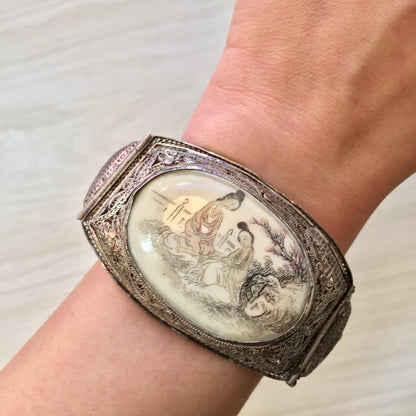 Antique sterling silver bracelet with carved horn depicting Asian figures, hinged filigree design