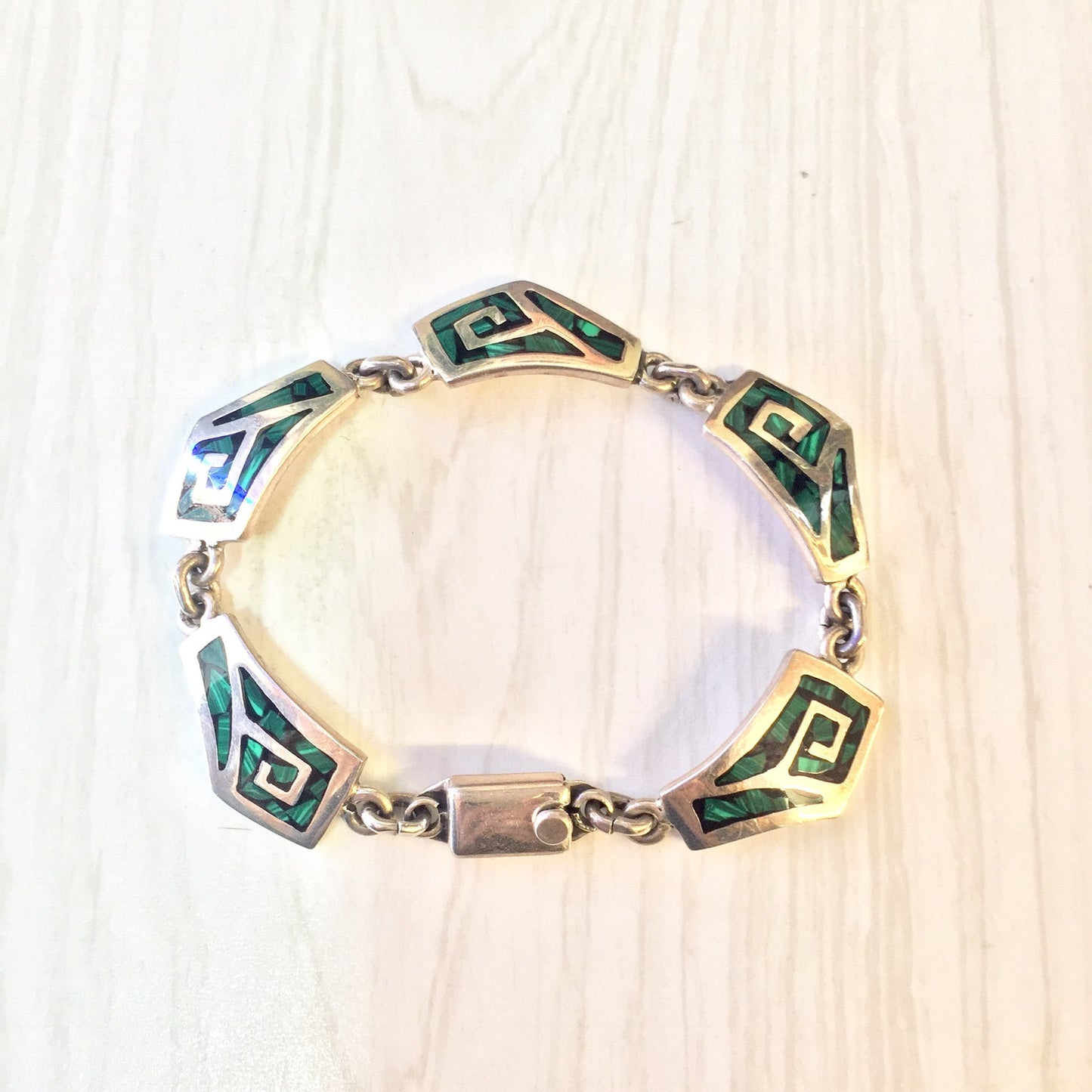 Vintage sterling silver link bracelet with inlaid green malachite gemstones, a unique and eye-catching piece of vintage jewelry that makes a great gift.