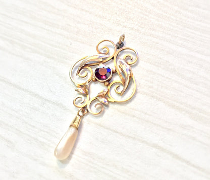 10K gold antique pendant with swirling design, featuring a freshwater pearl drop and a round purple amethyst gemstone accent.