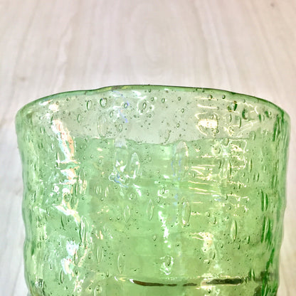 Vintage green vaseline glass cup with rippled texture and pontil mark, hand-blown depression era collectible glassware