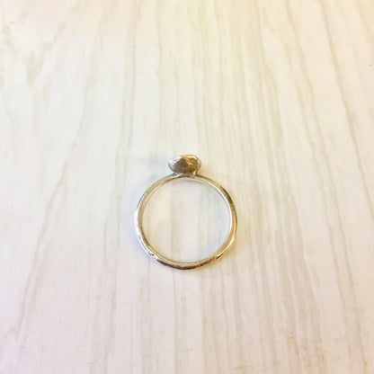 Vintage sterling silver ring with diamond solitaire on wooden surface, perfect as an engagement ring, promise ring or gift for her.