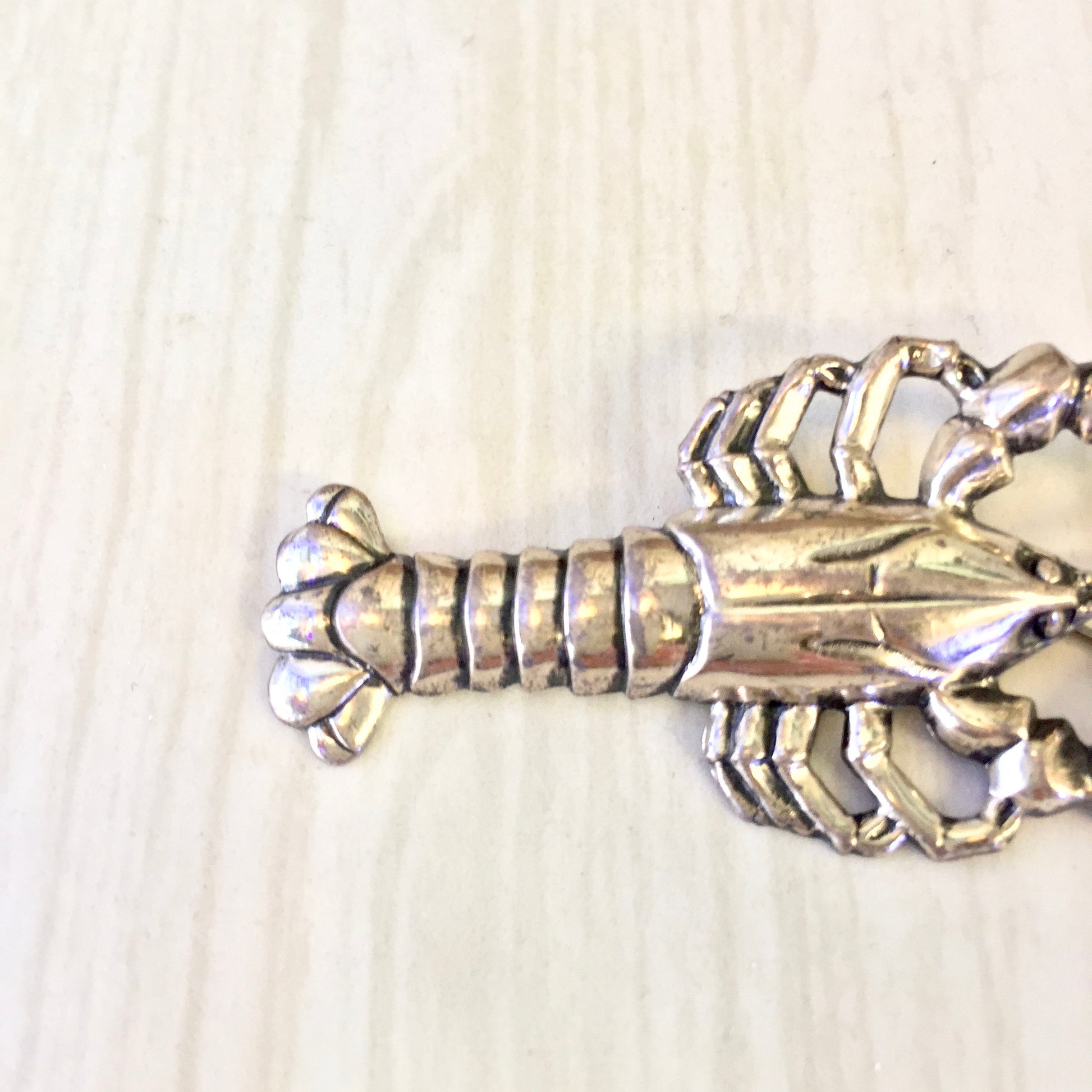 Vintage sterling silver lobster brooch pin, detailed crustacean jewelry design, perfect holiday gift idea from vintage jewelry collection.