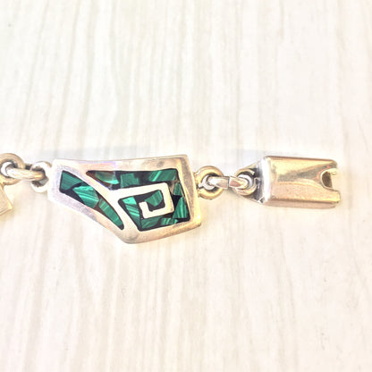 Vintage sterling silver link bracelet with green malachite stone inlays, a unique and eye-catching piece of vintage jewelry that makes a great gift.