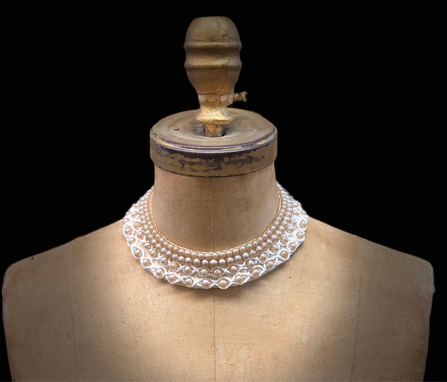 Vintage pearl beaded collar necklace on antique mannequin