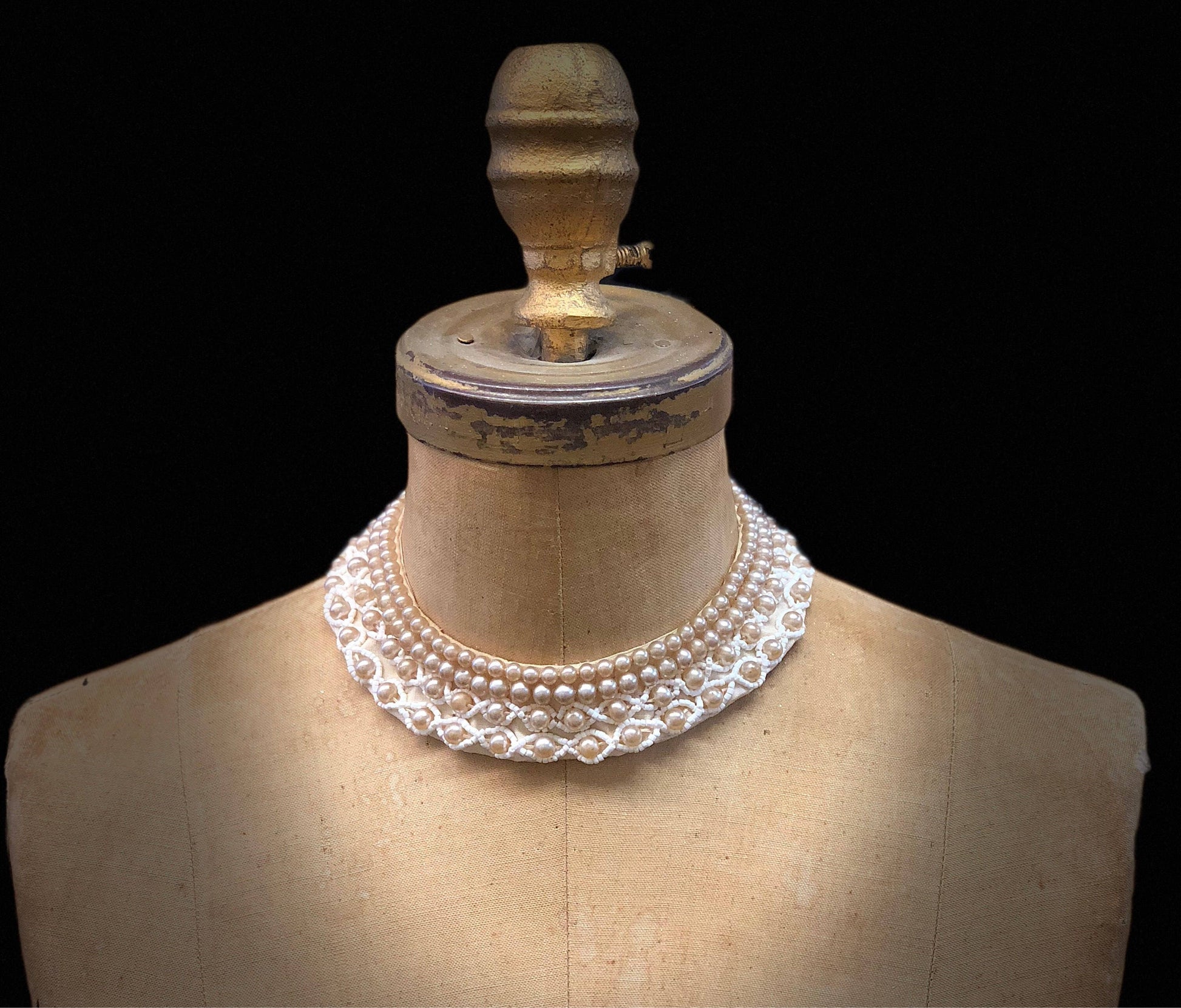 Vintage pearl beaded collar necklace on antique mannequin