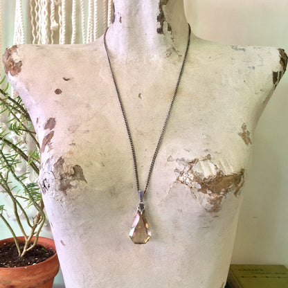 Vintage art deco style long chain necklace with large smoky quartz pendant on decorative dress form, ideal holiday gift idea