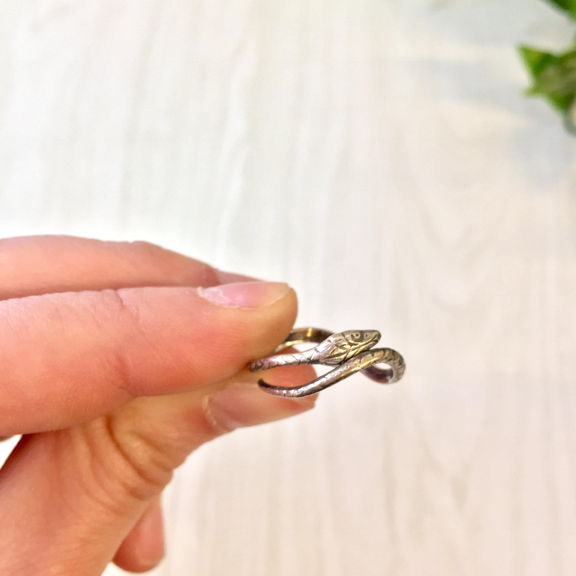 Vintage silver snake ring worn on finger, bohemian jewelry gift