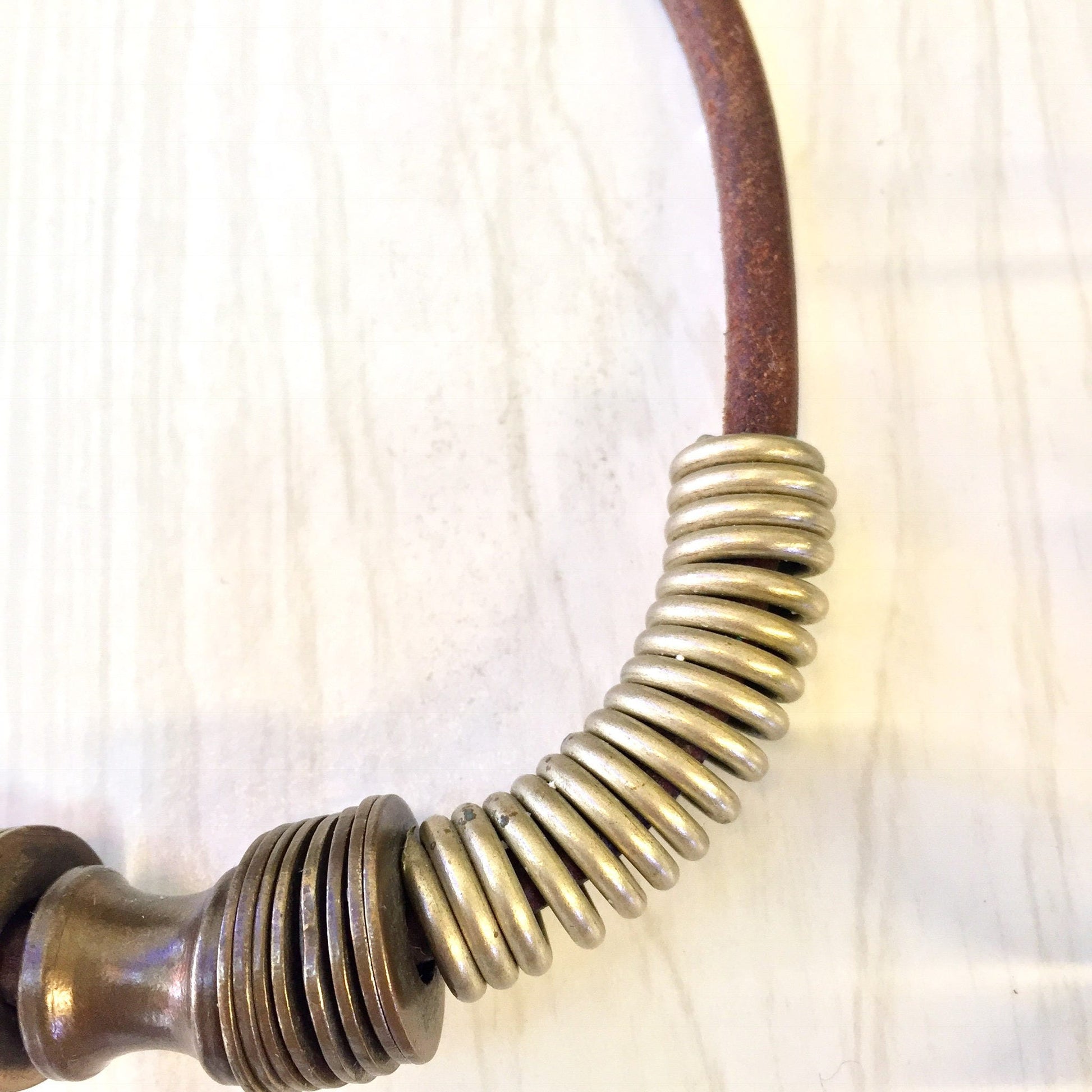 Vintage brass coil choker necklace on leather cord, ethnic statement jewelry for a unique Mothers Day gift