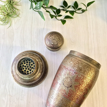 Vintage etched metal cocktail shaker with floral design in silver and red, mixology barware