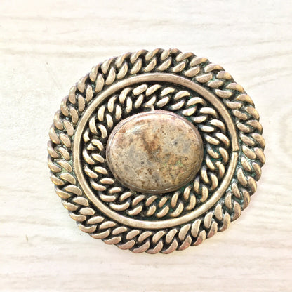 Vintage sterling silver brooch with natural stone from Taxco, Mexico. Round pin features intricate braided rope design border. Unique jewelry gift idea.