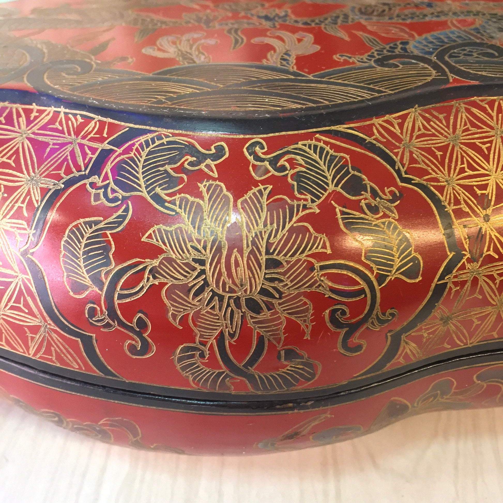 Vintage red and gold Asian laminated box with intricate blue dragon and floral designs, suitable for storing jewelry, trinkets or serving as a decorative catch-all dish.