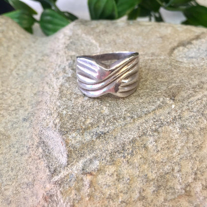 Vintage sterling silver band ring with X design on stone background, perfect gift idea for Mother's Day or statement jewelry piece.