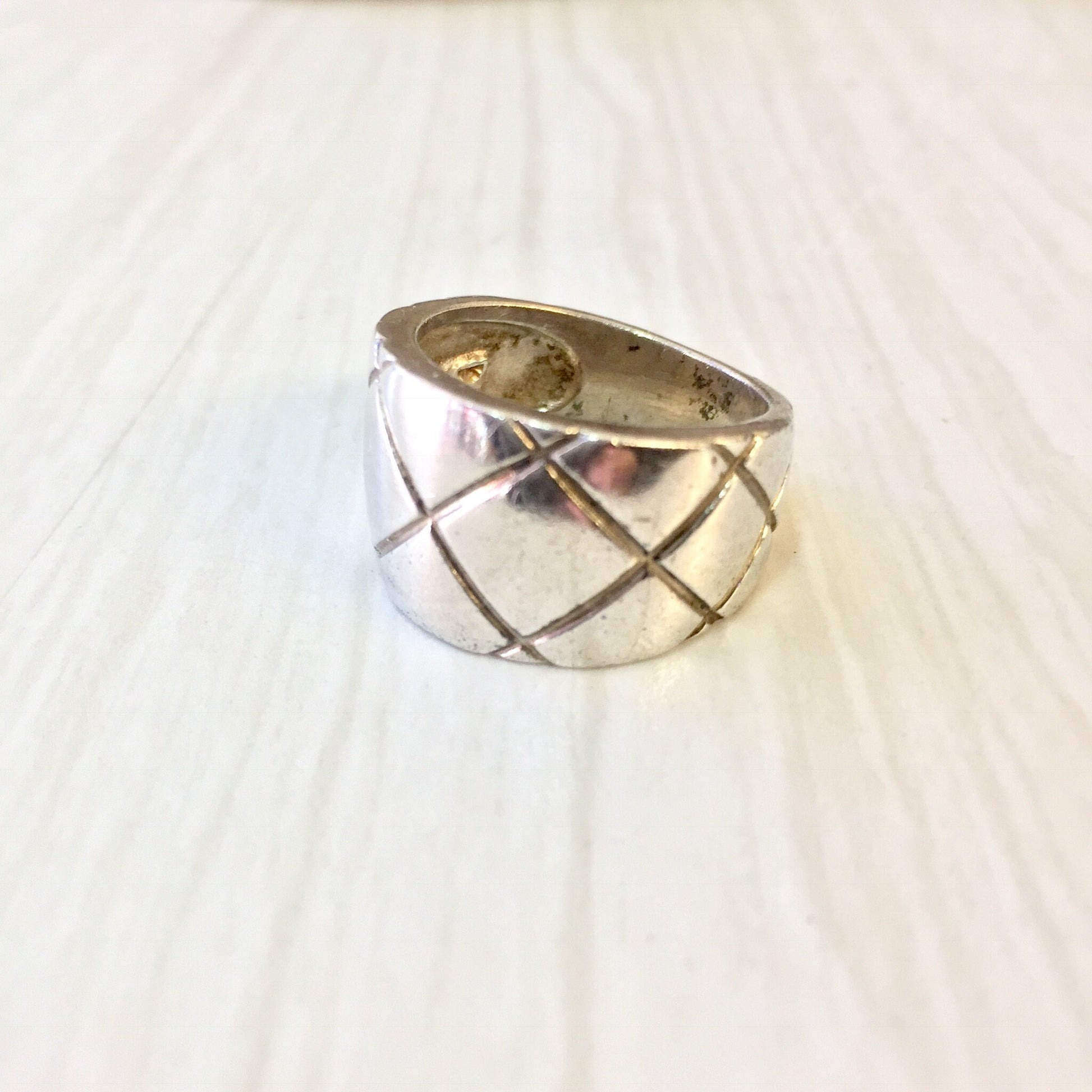 Vintage sterling silver ring with thick band and diamond X pattern design