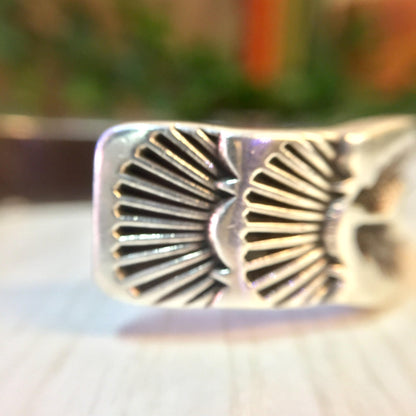 Vintage Hopi silver cuff bracelet with stamped sun, moon and star designs, a rare piece of Hopi jewelry and unique gift idea.