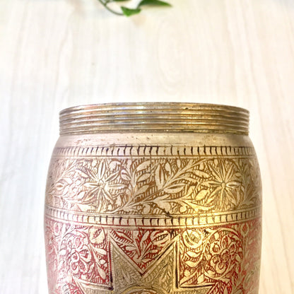 Vintage etched metal cocktail shaker with red and silver floral design, Indian-inspired mixology barware