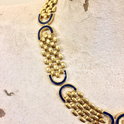 Vintage gold tone chain link necklace with dark blue accents, statement jewelry piece