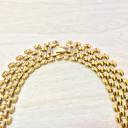 Vintage gold tone chain link statement necklace on light background