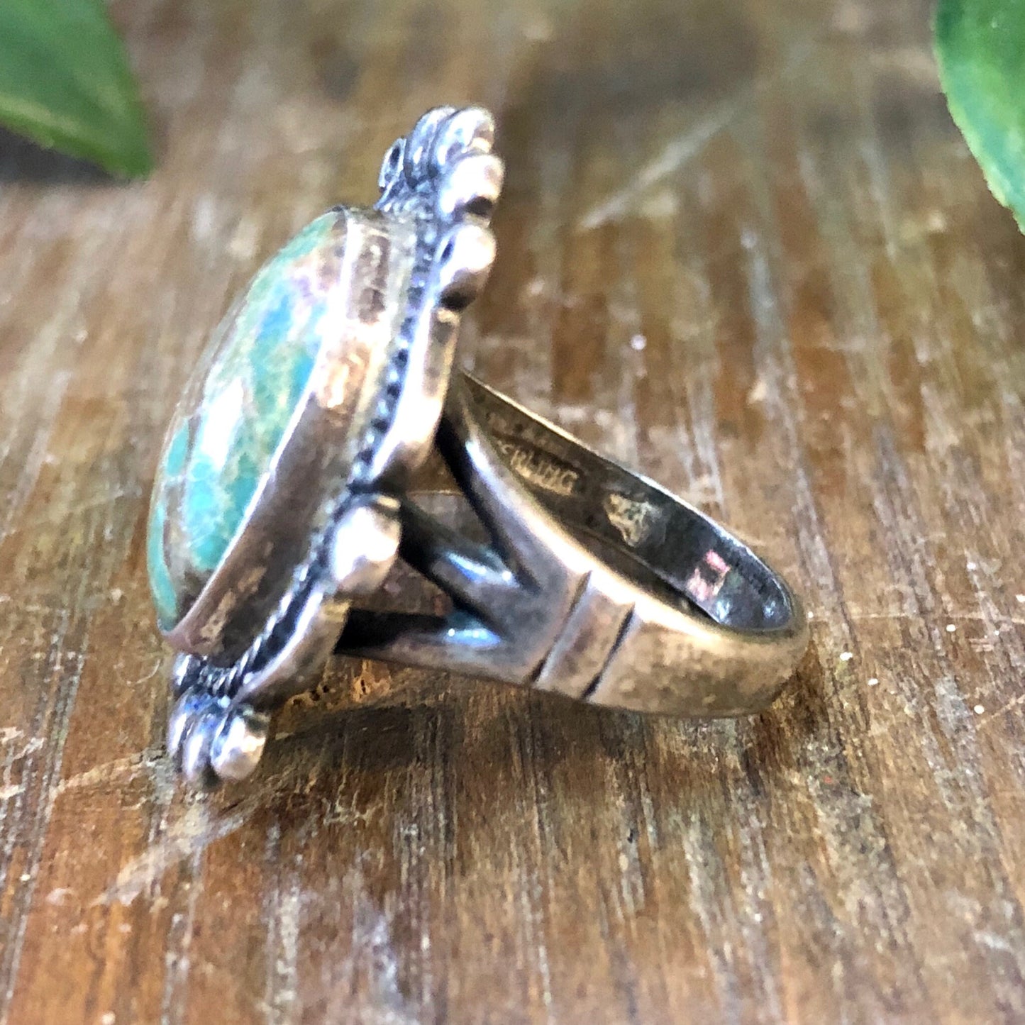 Vintage sterling silver ring with oval blue Royston turquoise cabochon stone, featuring intricate twisted rope and beaded detailing on the band. Bohemian style jewelry.