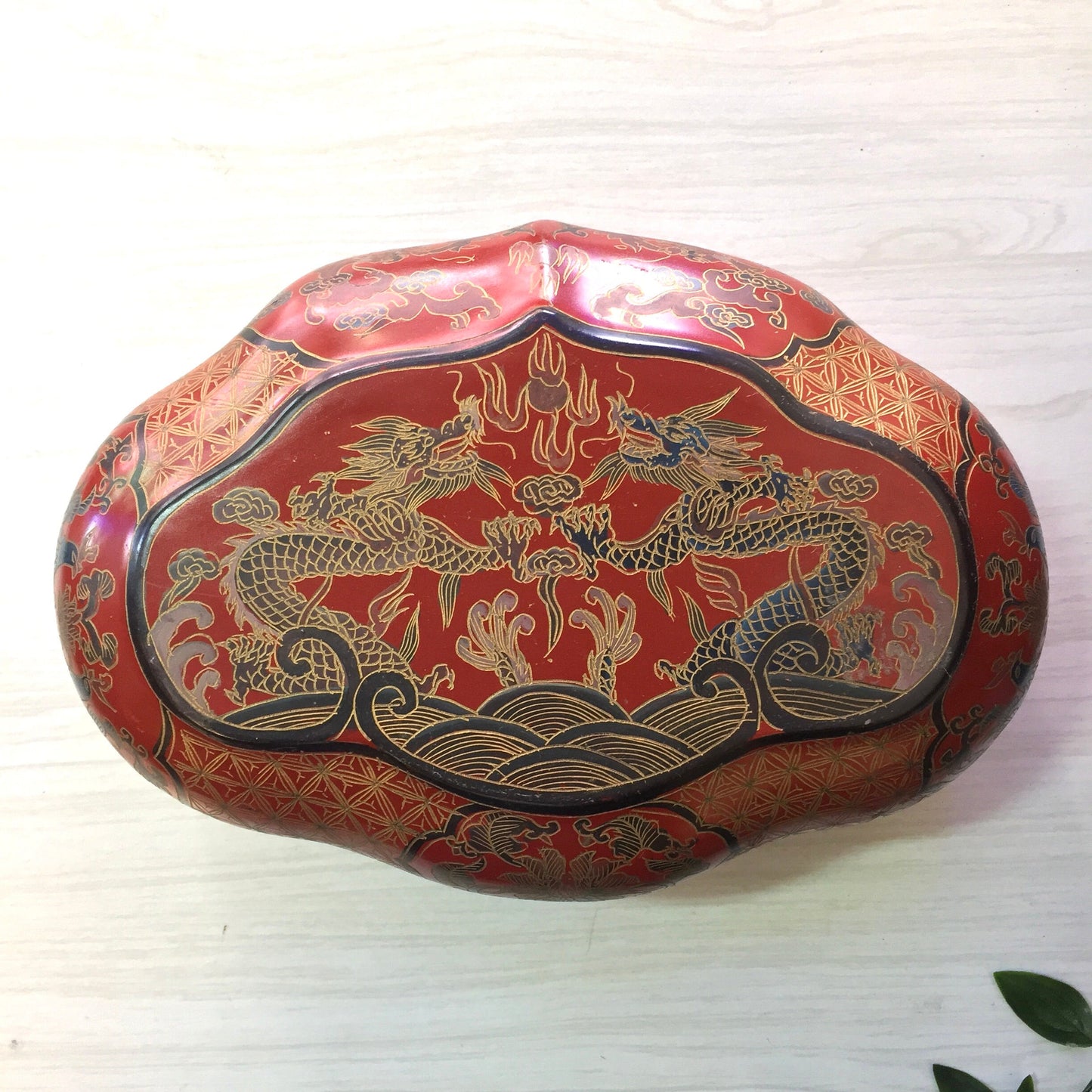 Vintage Asian red laminated box featuring gold and blue dragon design, suitable for storing jewelry, trinkets or serving as a catch-all dish.