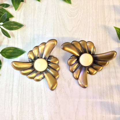 Gold flower clip-on earrings with black and white accents, vintage statement jewelry