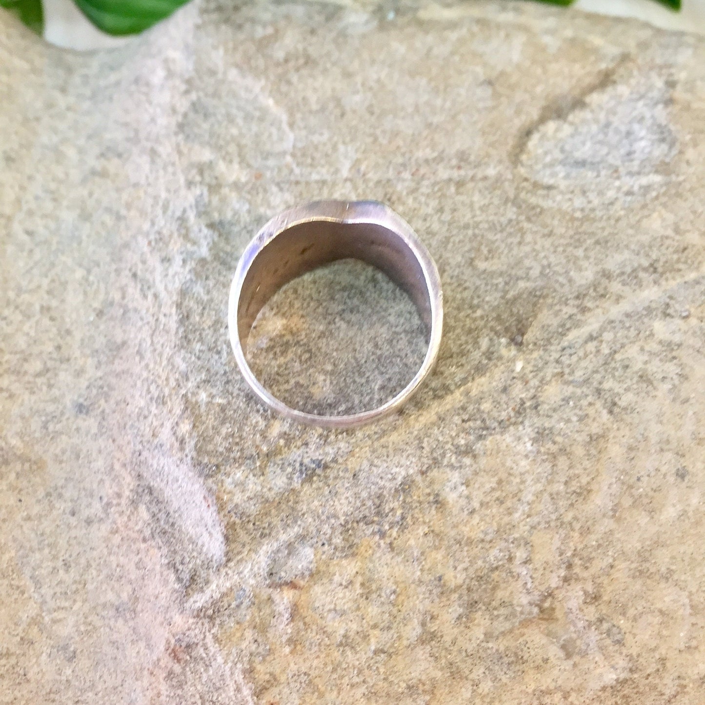 Vintage sterling silver wide band ring with X design on textured metal surface, perfect statement jewelry gift for Mother's Day or any occasion.