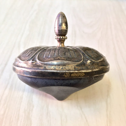 Antique sterling silver and ebony spinning top toy by Gorham, engraved with fortunes around the sides, lidded with a pointed finial.