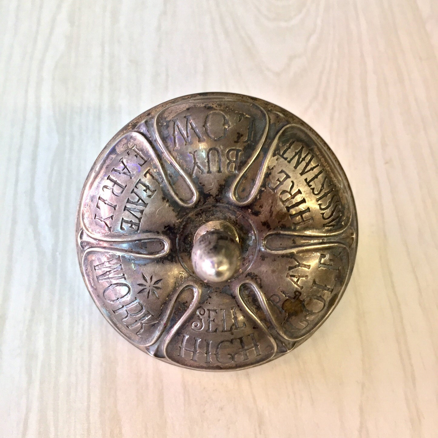 Antique Gorham sterling silver and ebony spinning top toy engraved with fortunes, astrological signs and months of the year.