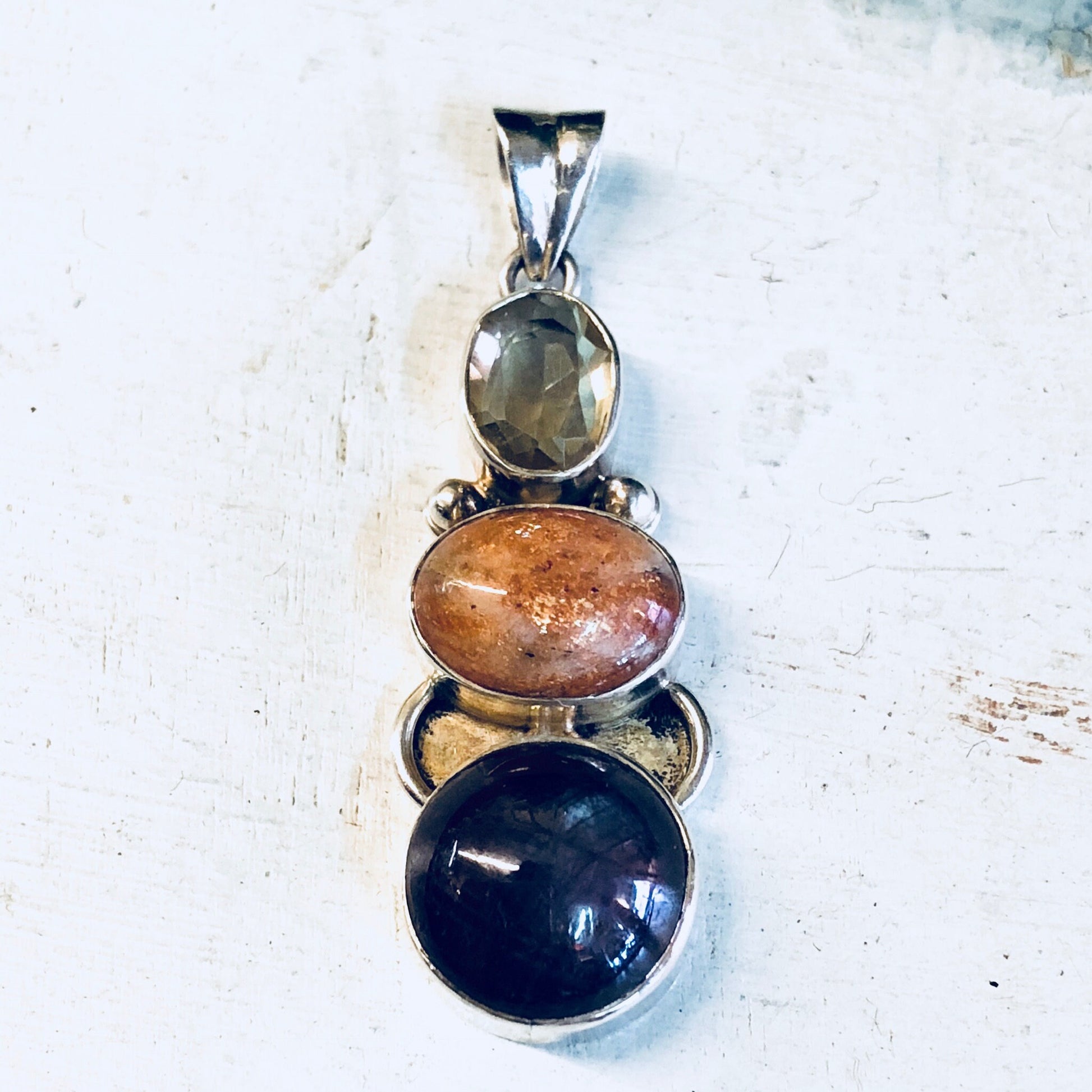 Vintage sterling silver pendant necklace with smoky quartz, orange, and purple natural stones