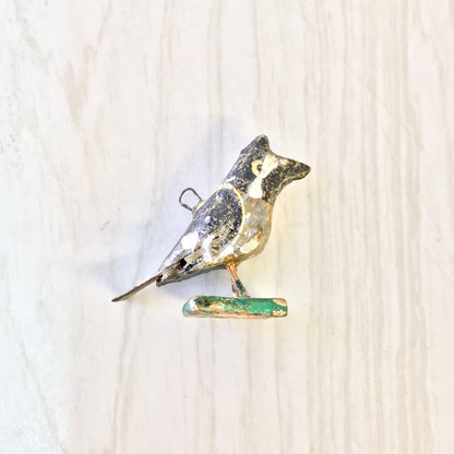 Handmade paper mache bird bead figurine with colorful painted details, suitable for arts and crafts or jewelry making projects like necklaces or bracelets.