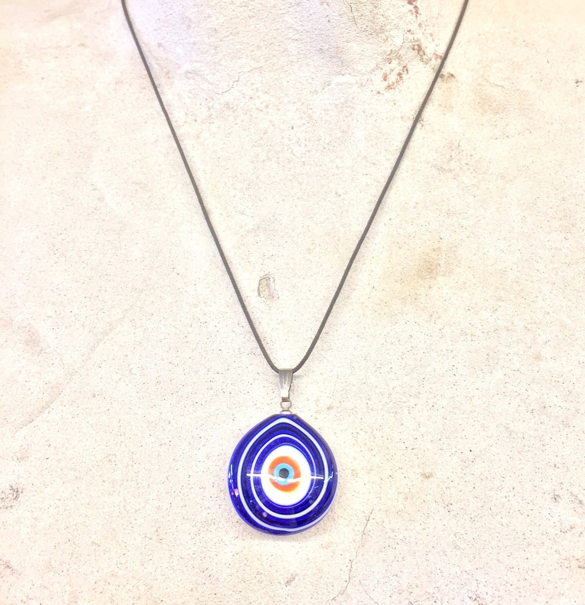 Vintage blue and white glass evil eye pendant necklace on silver chain