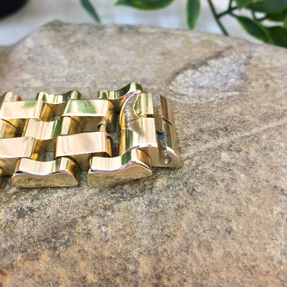 Vintage gold-toned chunky chain link bracelet on stone surface, suitable as a gift for Mom or vintage jewelry enthusiast.