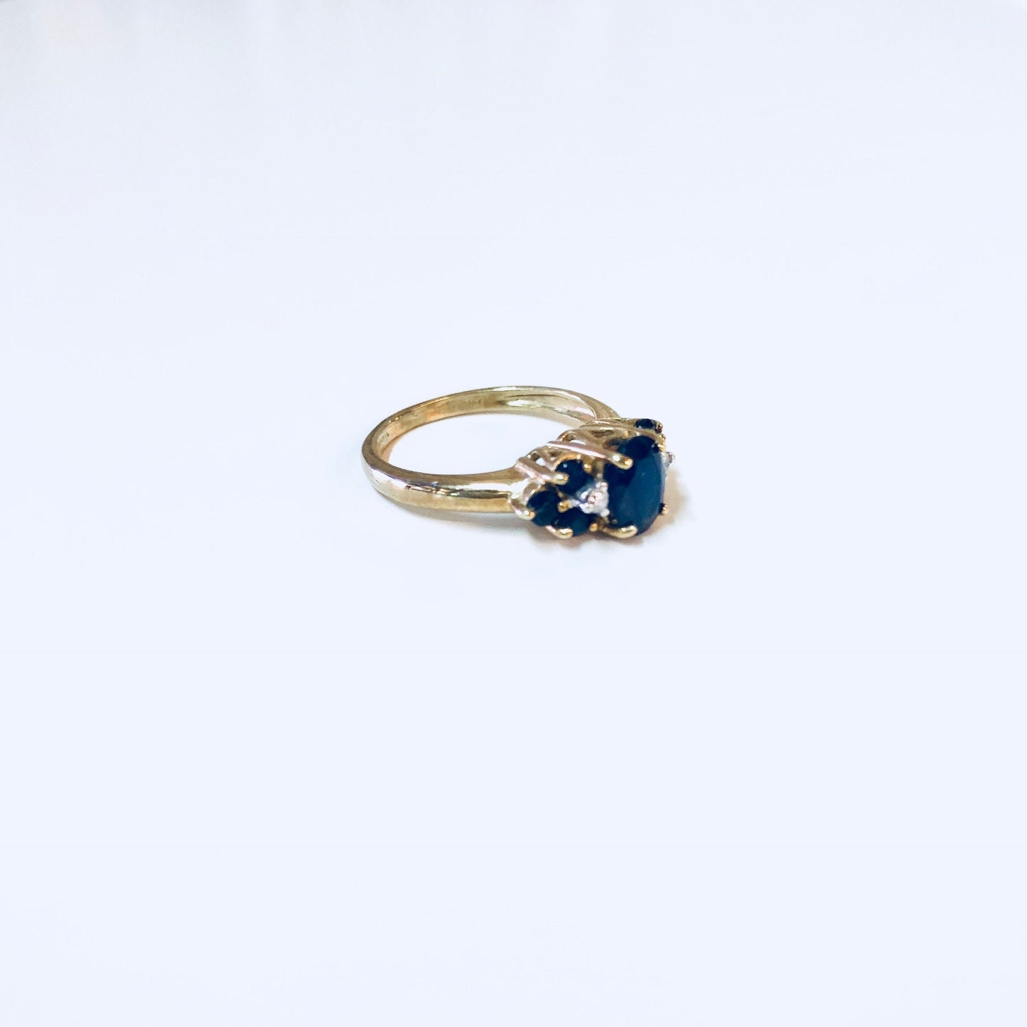 Vintage 14K yellow gold ring with blue sapphire stones, suitable for engagement, wedding or September birthstone jewelry.