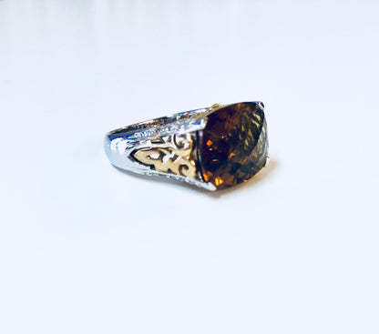 Vintage sterling silver cocktail ring with topaz-colored cubic zirconia stone in ornate gold setting, ideal for anniversaries or statement jewelry.