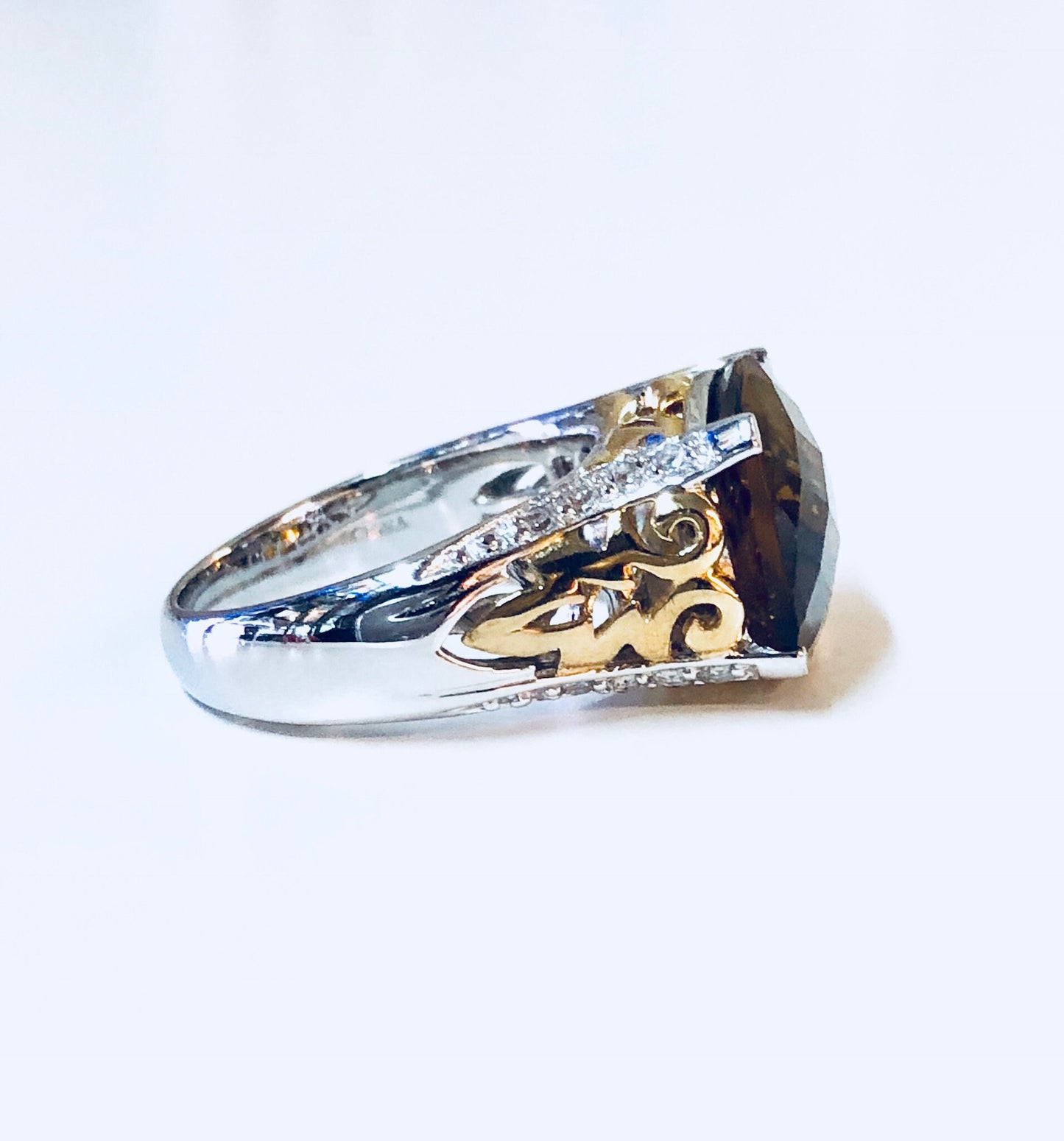 Vintage silver cocktail ring with topaz and cubic zirconia accents, featuring ornate gold detailing. A statement sterling silver ring suitable as an anniversary gift or vintage jewelry piece.