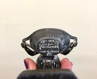 A vintage black Vantines incense burner from 1924 made in France, featuring an Art Deco Egyptian revival sculptural design resembling a goddess figurine.