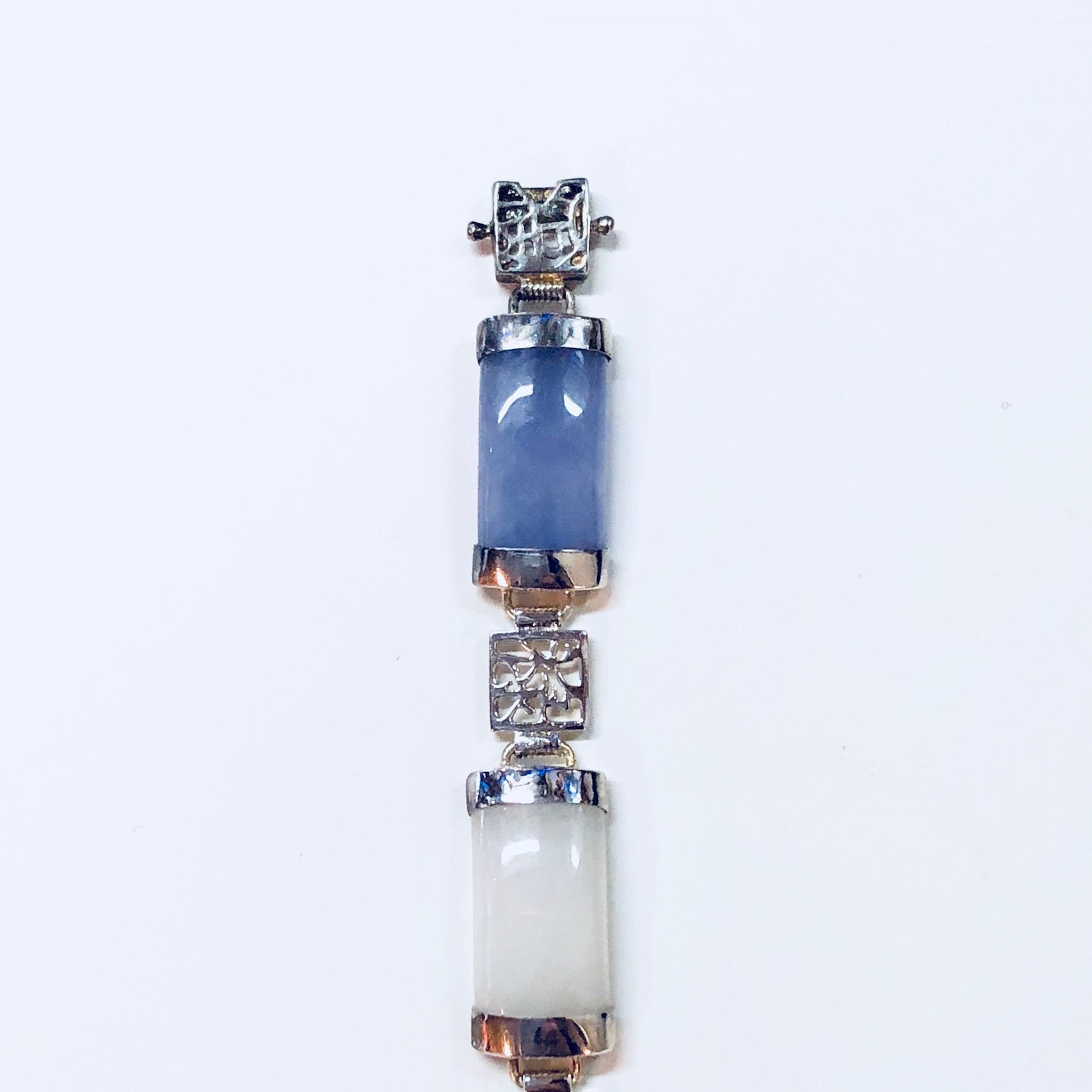 Vintage sterling silver link bracelet with natural jade stones in shades of blue, white, purple, orange and red