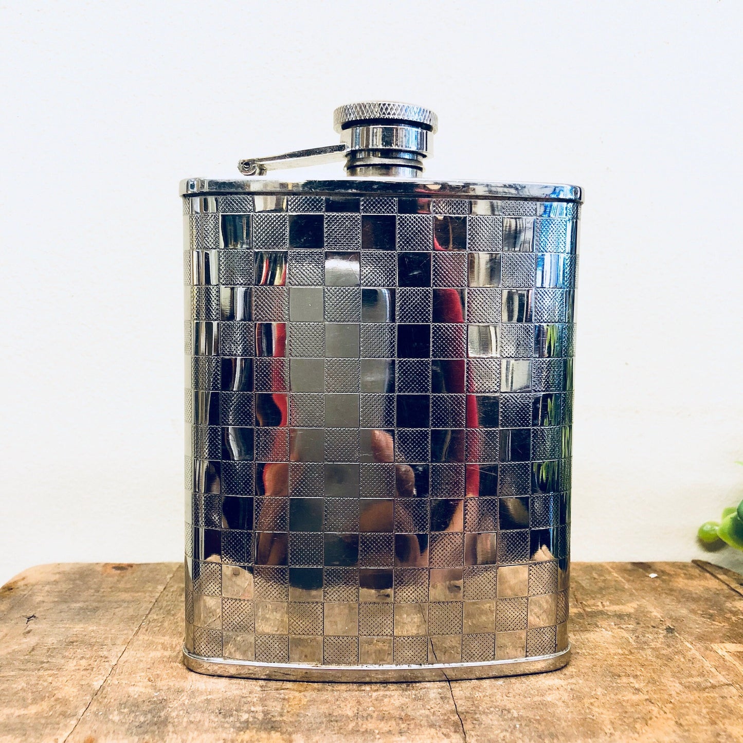 Vintage stainless steel flask with checkered blue and silver pattern, 6 ounce capacity, for whiskey or spirits, retro barware