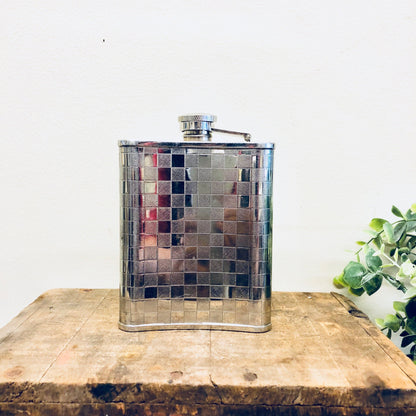 Vintage stainless steel flask with checkered pattern design, 6 ounce capacity, ideal for whisky, spirits and booze, retro barware accessory.